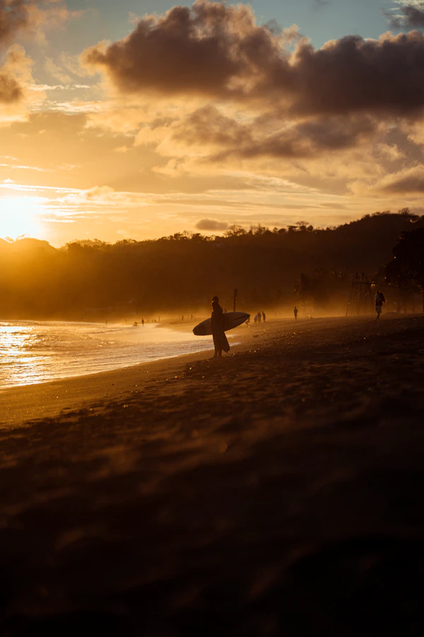 Carrying a surfboard at Playa Venao