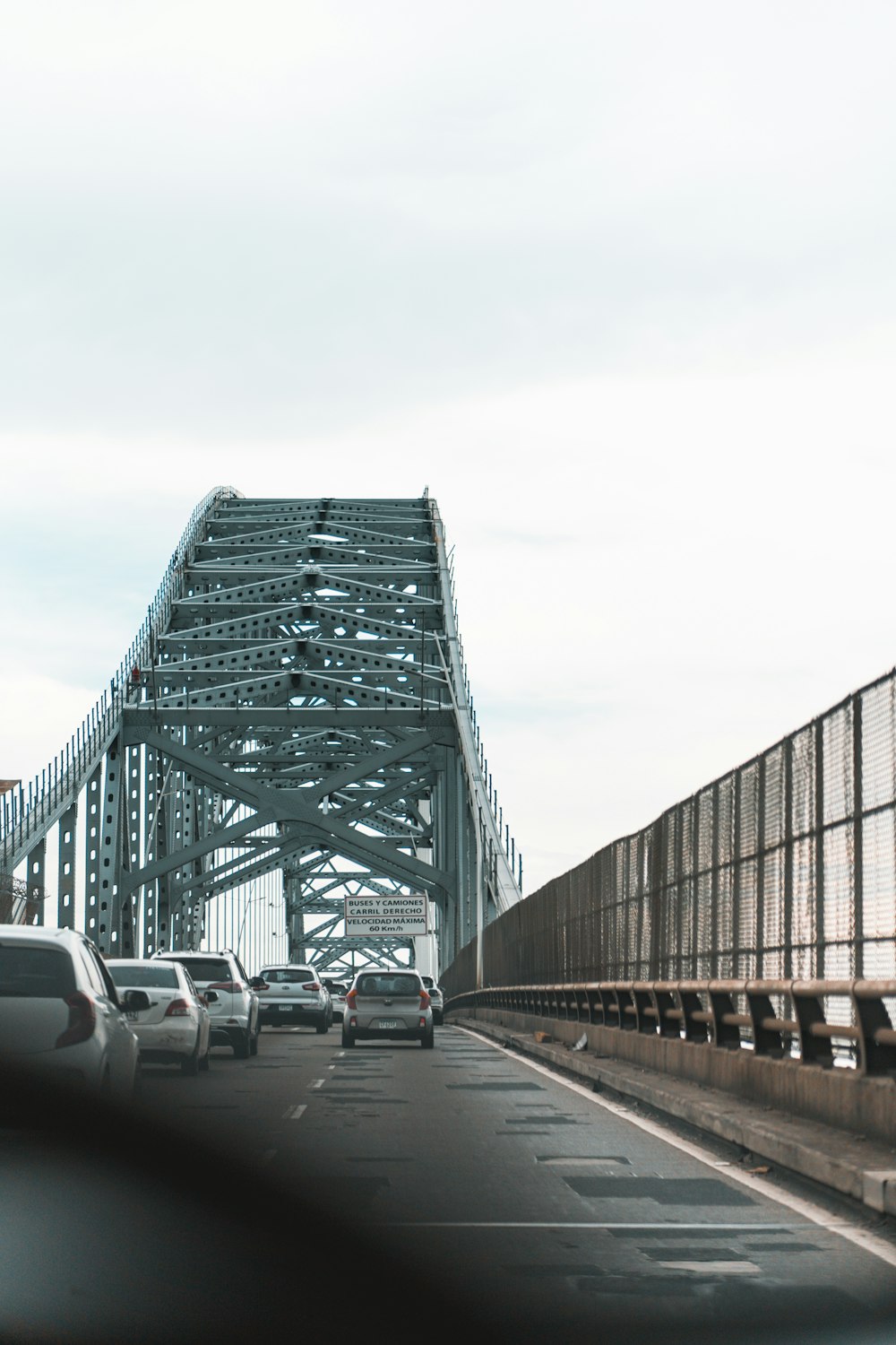 a view of a bridge from a car on a highway