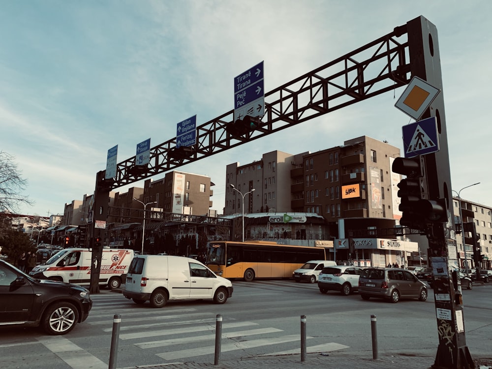 a busy city street with cars and buses