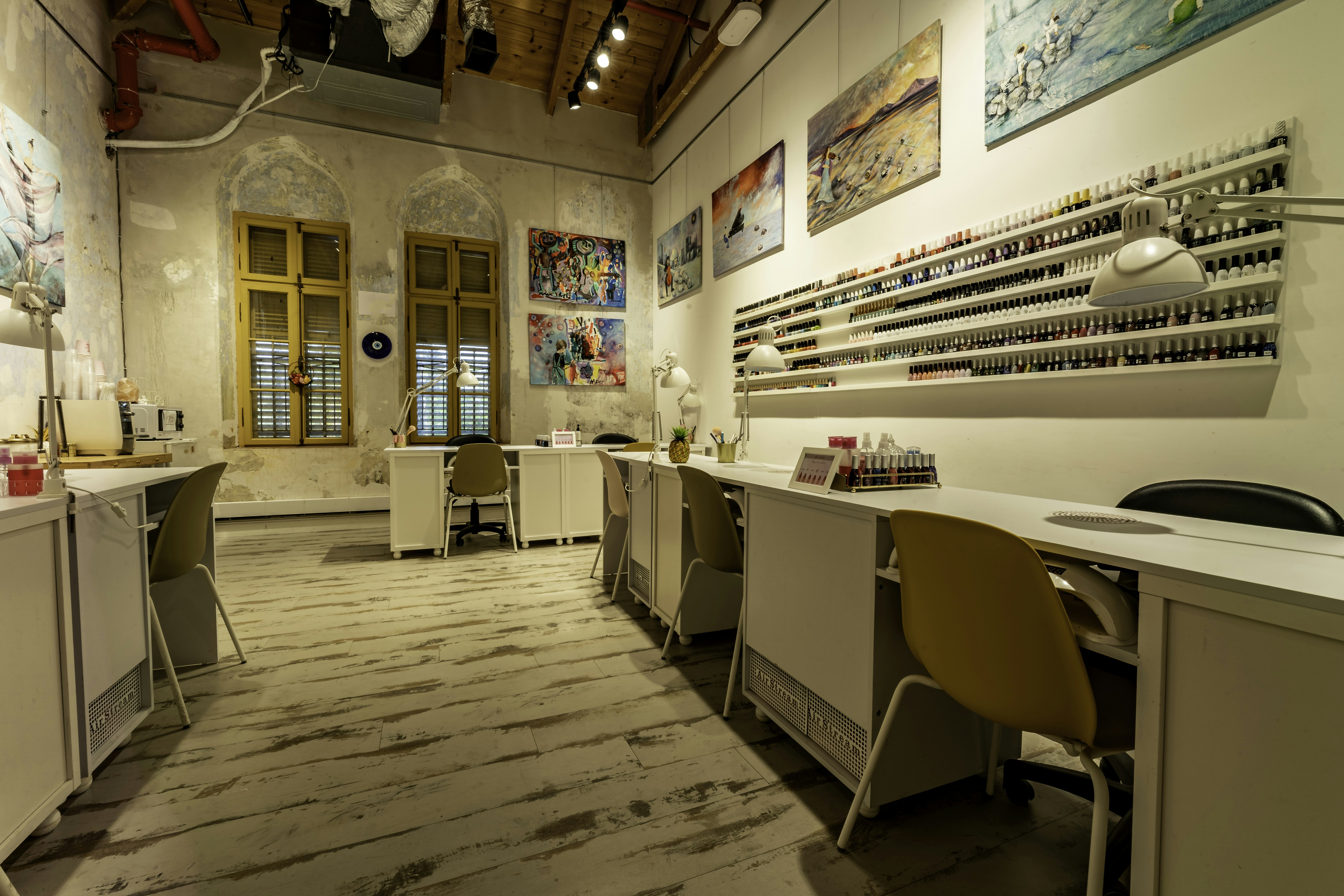 a nail salon with a lot of manicures on the walls