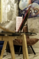 Close-up of interactive pricing table with glowing hover expansions on a sleek glassmorphism card.