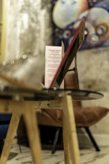 Close-up of a modern card UI displaying top-selling cafe menu items with vibrant accents.