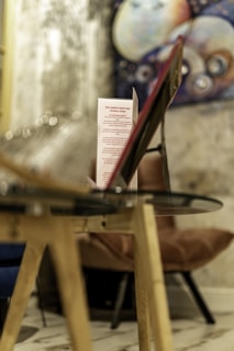 Close-up of interactive pricing table with glowing hover expansions on a sleek glassmorphism card.