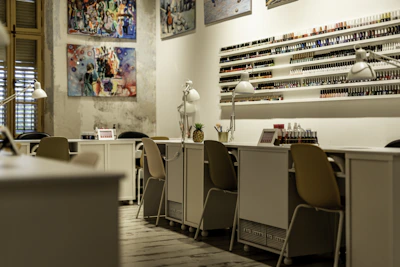 a nail salon with chairs and a counter