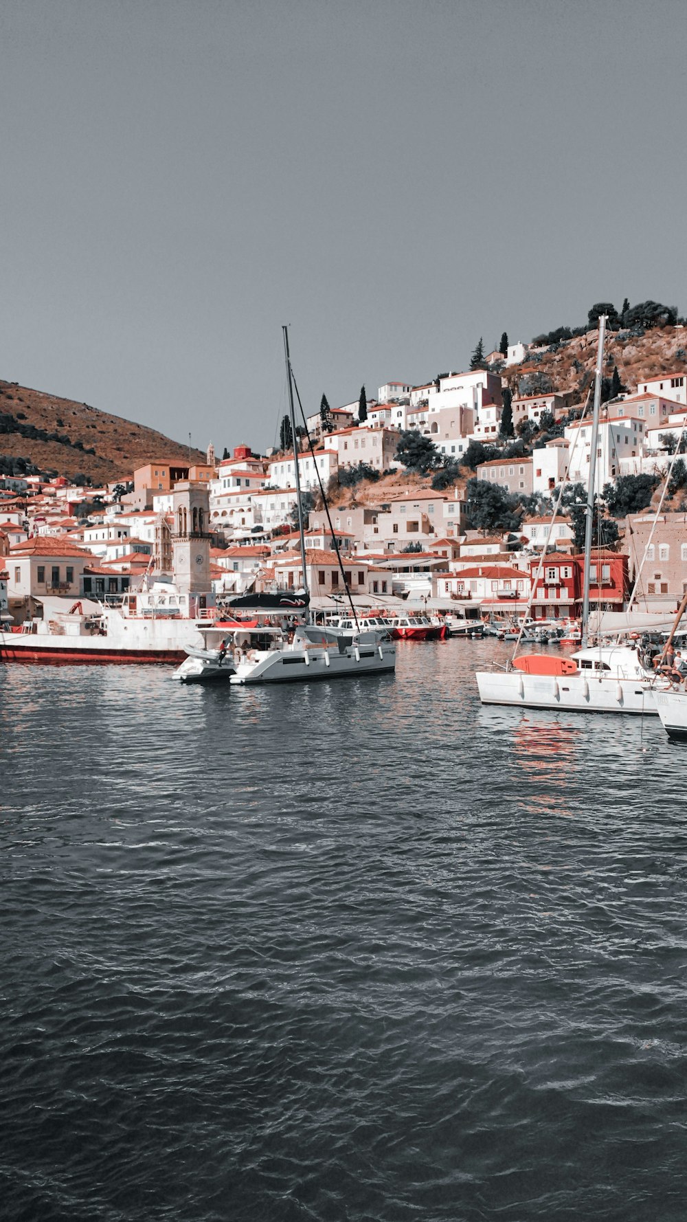 a group of boats floating on top of a body of water