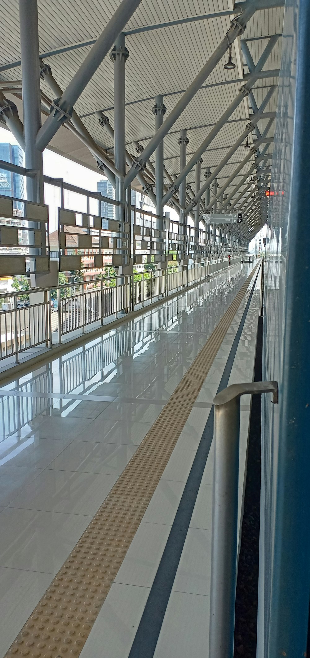 a train station with a long line of benches