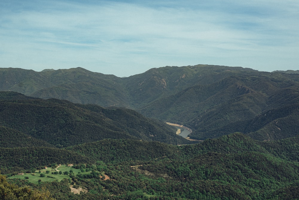 a scenic view of a valley and mountains