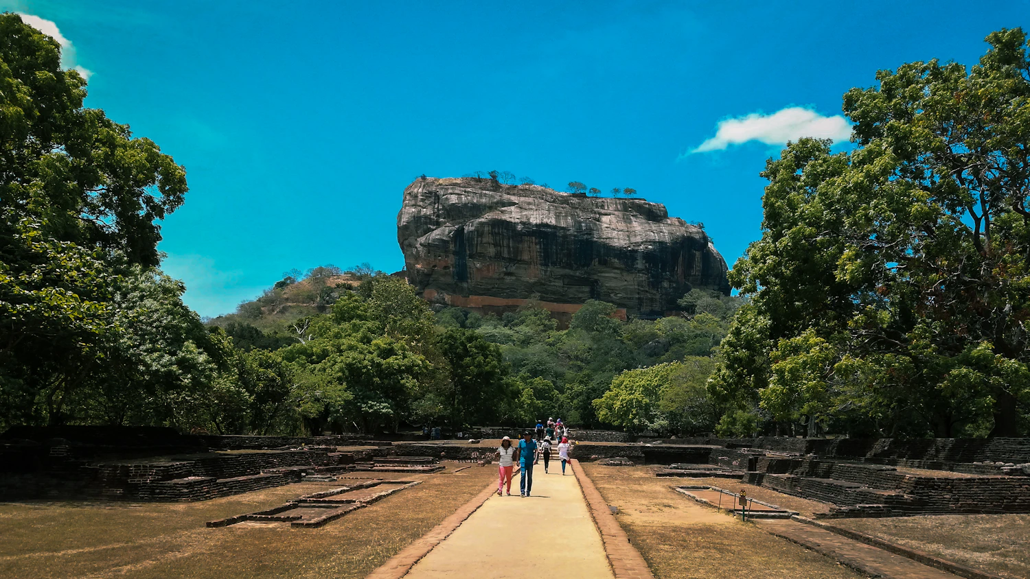 Visitors walking towards Sigiriya Rock in Sri Lanka