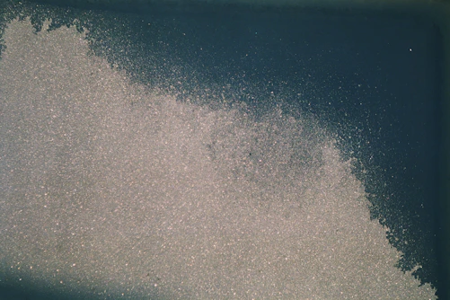 a large amount of white powder on a blue background