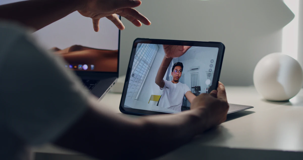 Person in a virtual therapy session on a laptop representing the effectiveness of online EMDR therapy for PTSD