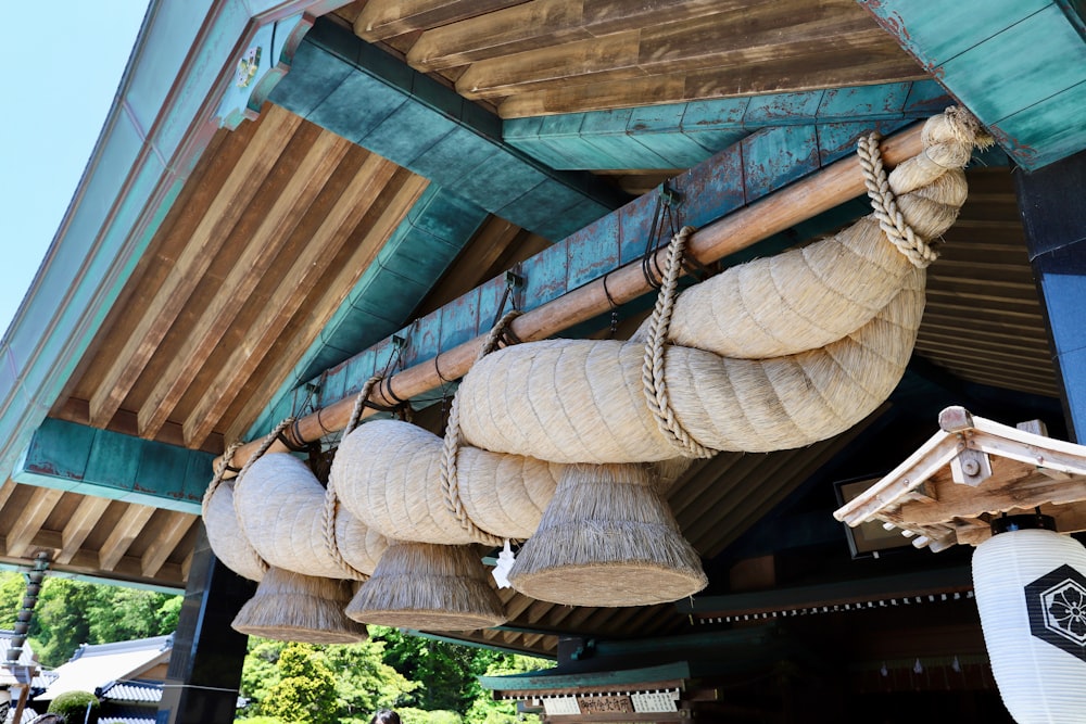 a bunch of hanging baskets hanging from a roof