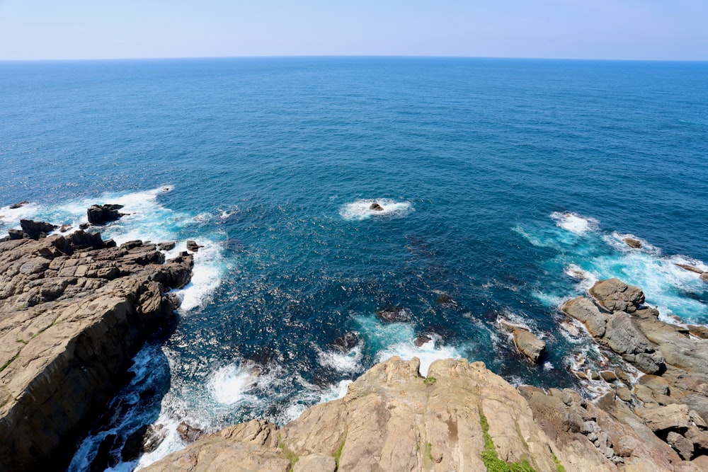 a view of the ocean from the top of a cliff