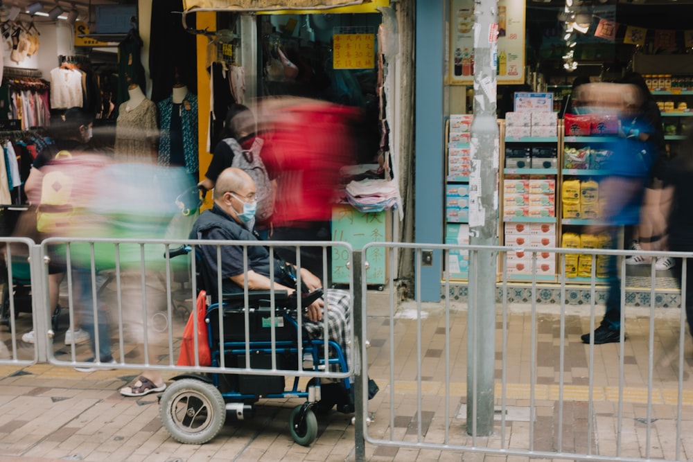 a man in a face mask pushing a shopping cart