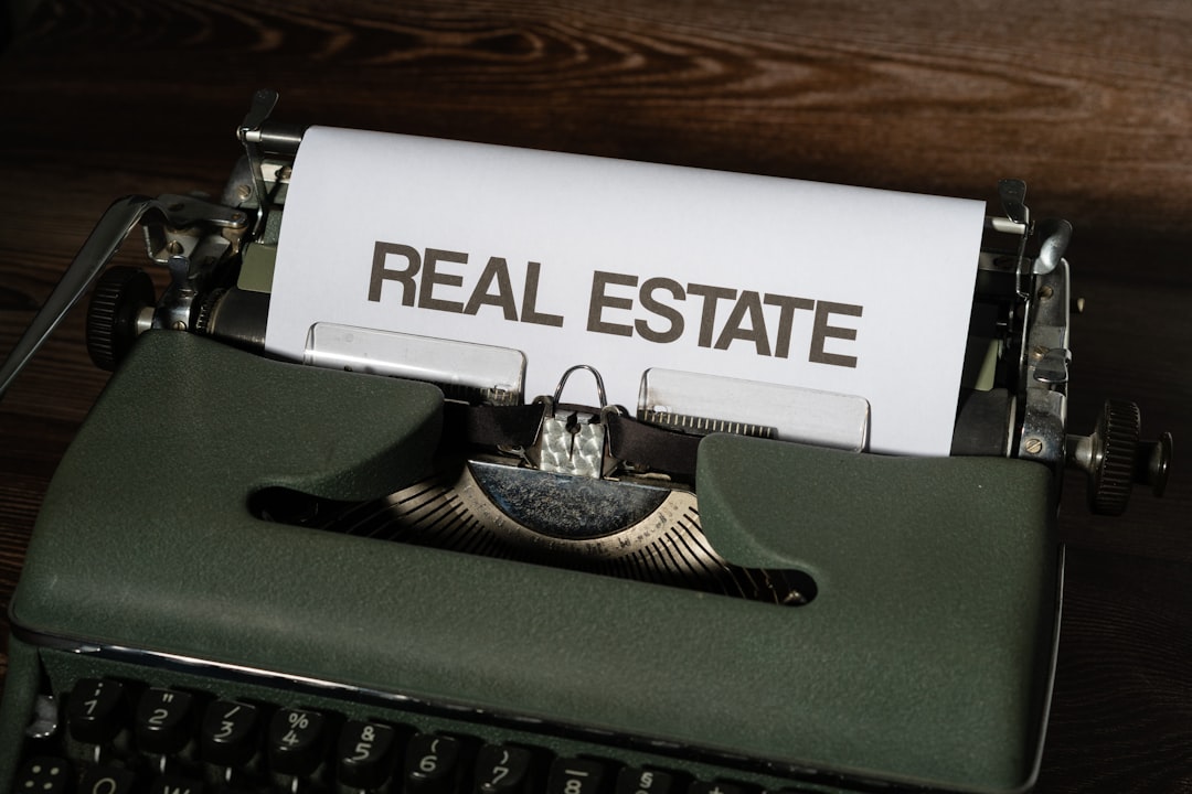 a close up of a typewriter with a real estate paper on it,