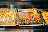 A variety of colorful pastries arranged invitingly on a display tray.