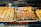 A vibrant display of assorted pastries and sweets in a bakery setting.