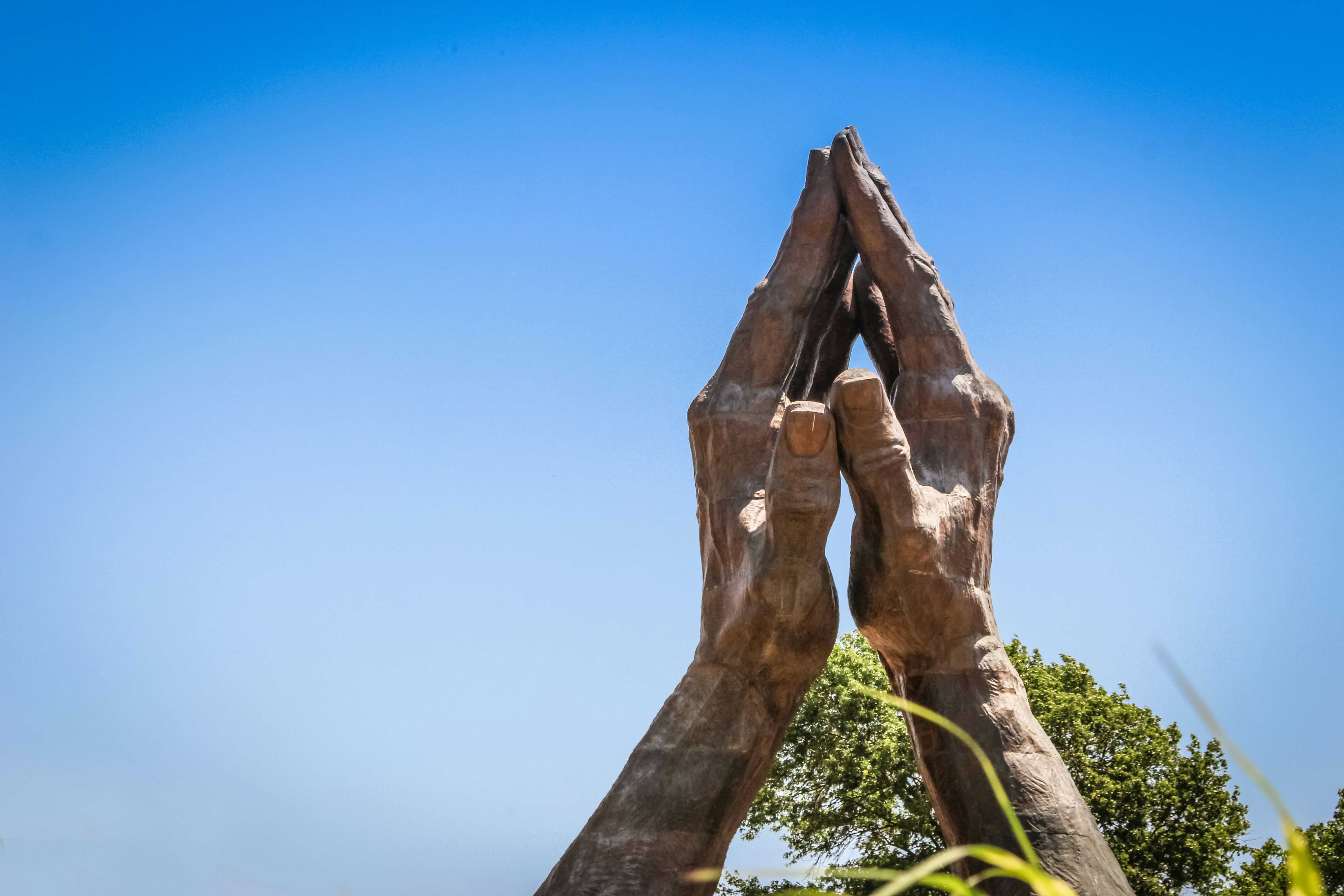 a statue of two hands holding each other