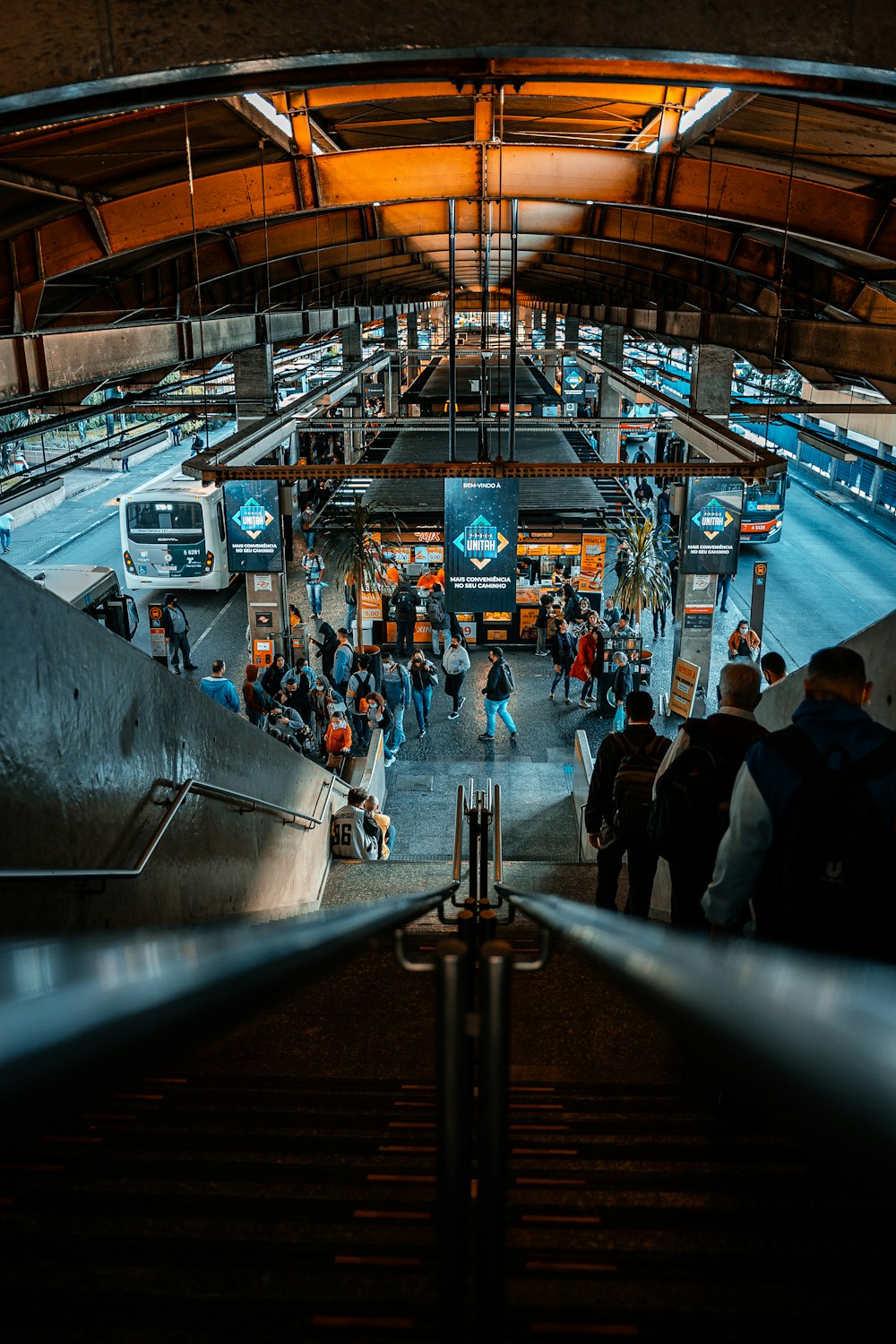 a group of people walking up and down a set of stairs