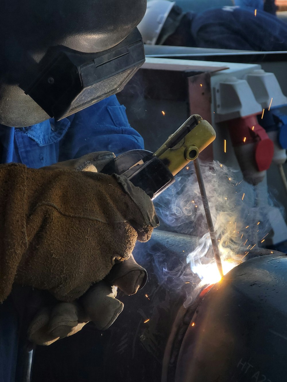 a welder working on a piece of metal