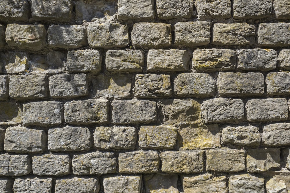 a close up of a wall made of rocks