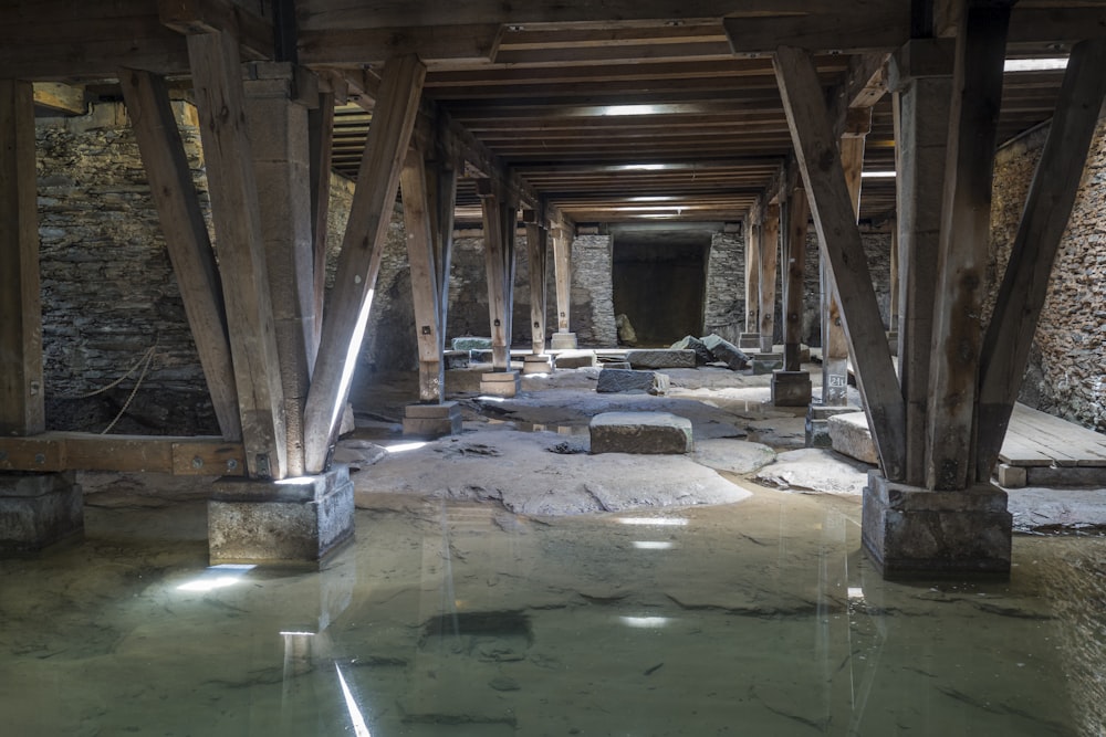 a very old looking building with some water in it