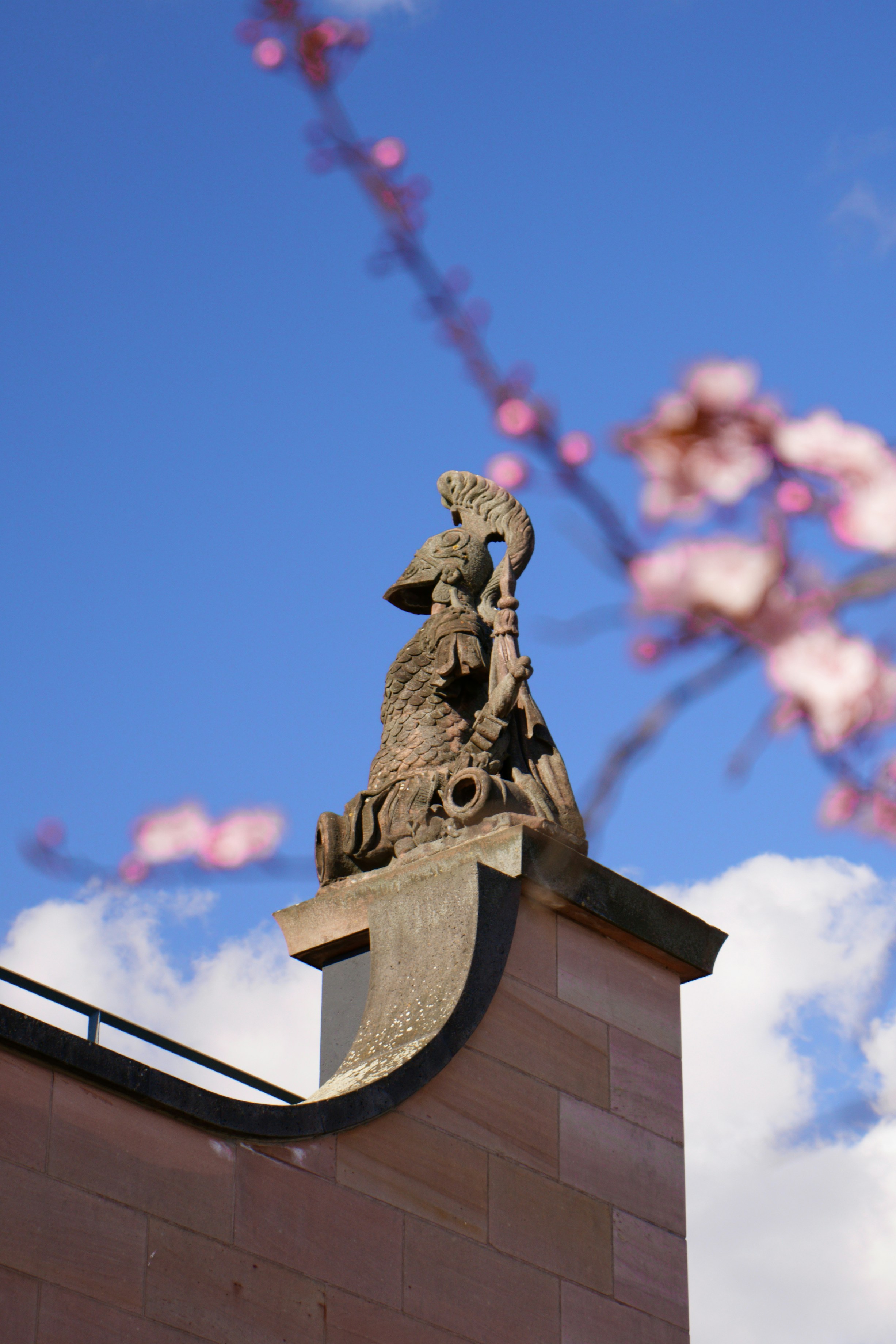 a statue on top of a brick building