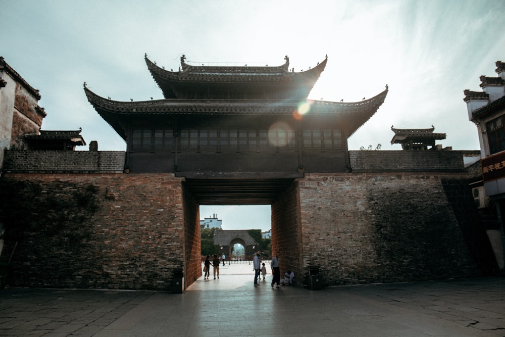 a large gate that has a building on top of it