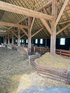 a barn filled with hay and hay bales