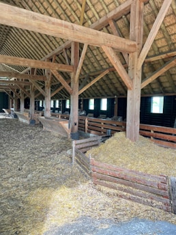 a barn filled with hay and hay bales
