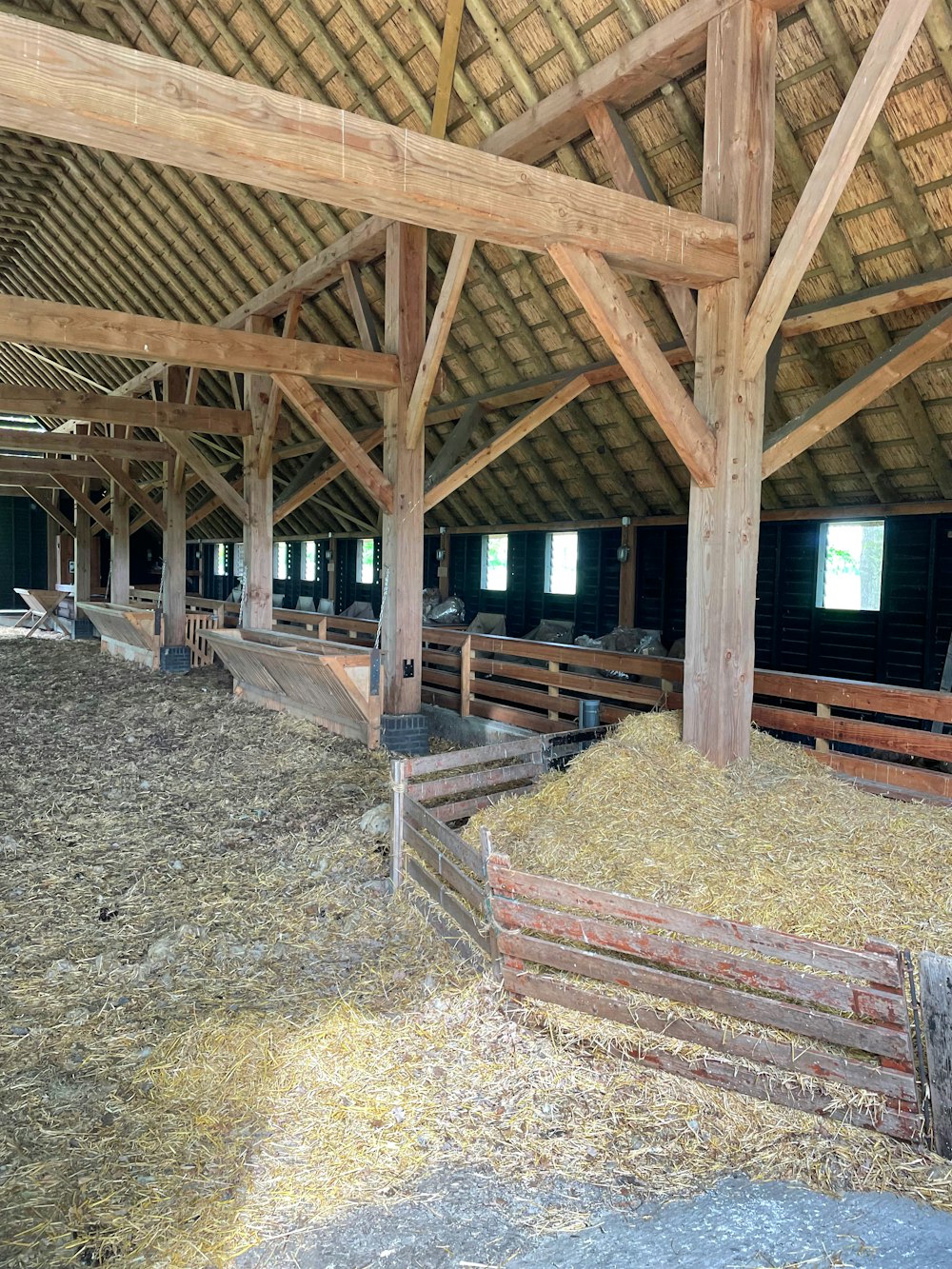 a barn filled with hay and hay bales