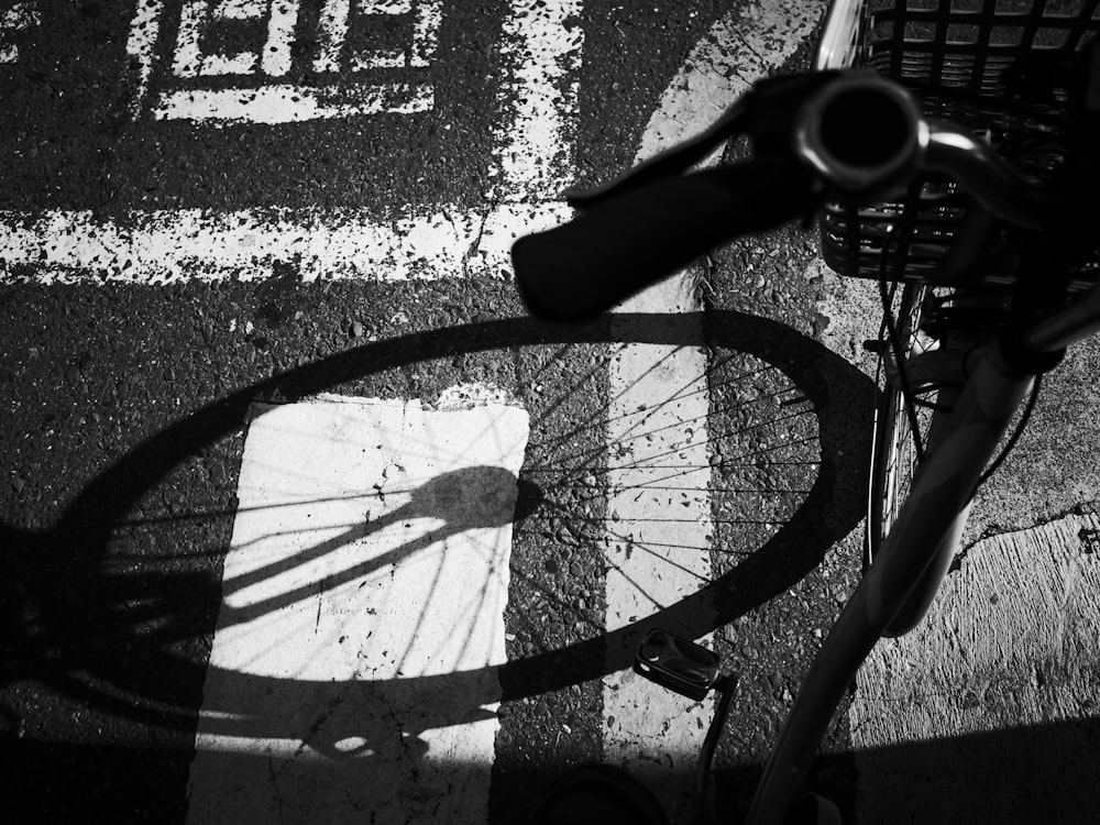 the shadow of a bicycle on the ground