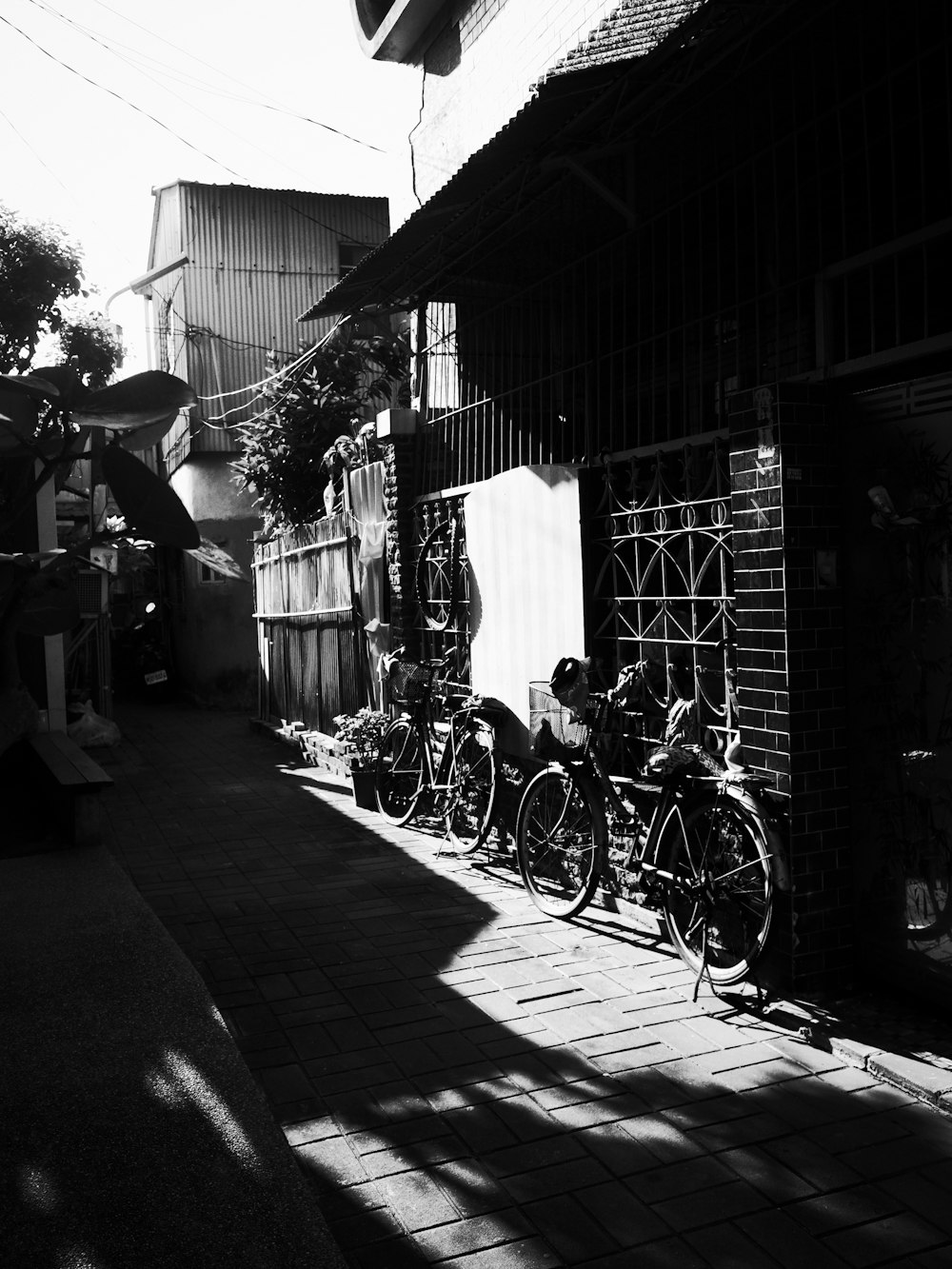 a row of bikes parked next to a building