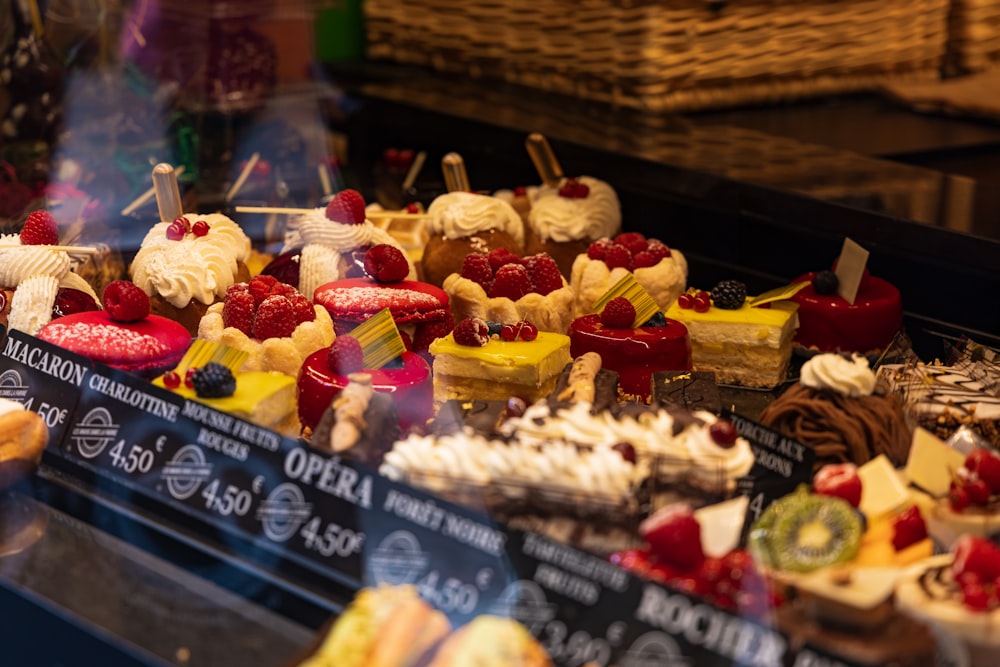 a display case filled with lots of different types of desserts