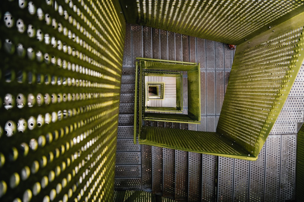 a room with a metal structure and a mirror