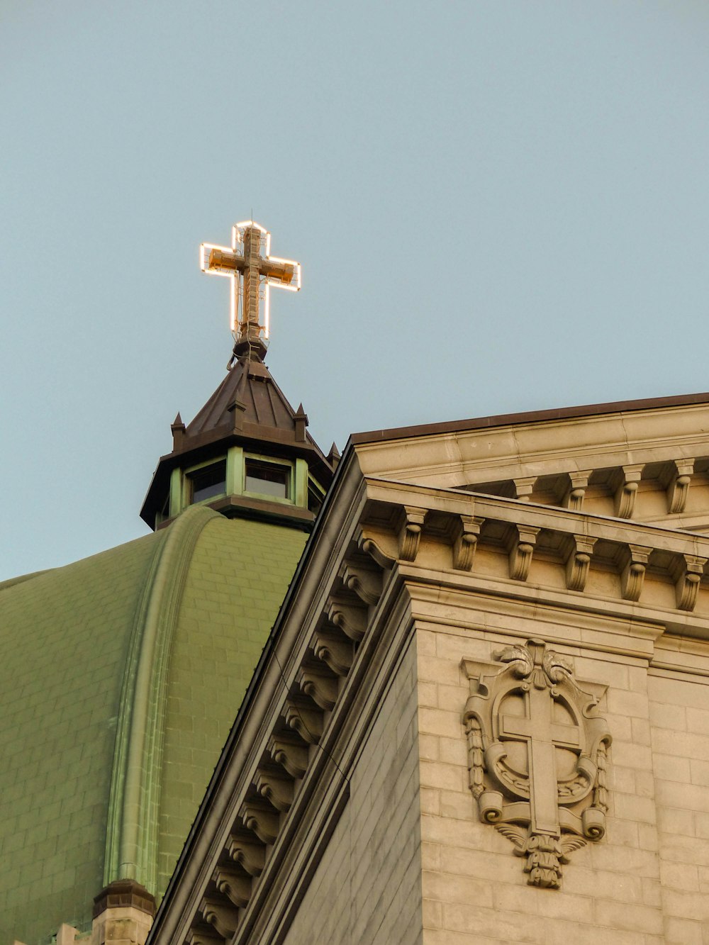 a church steeple with a cross on top