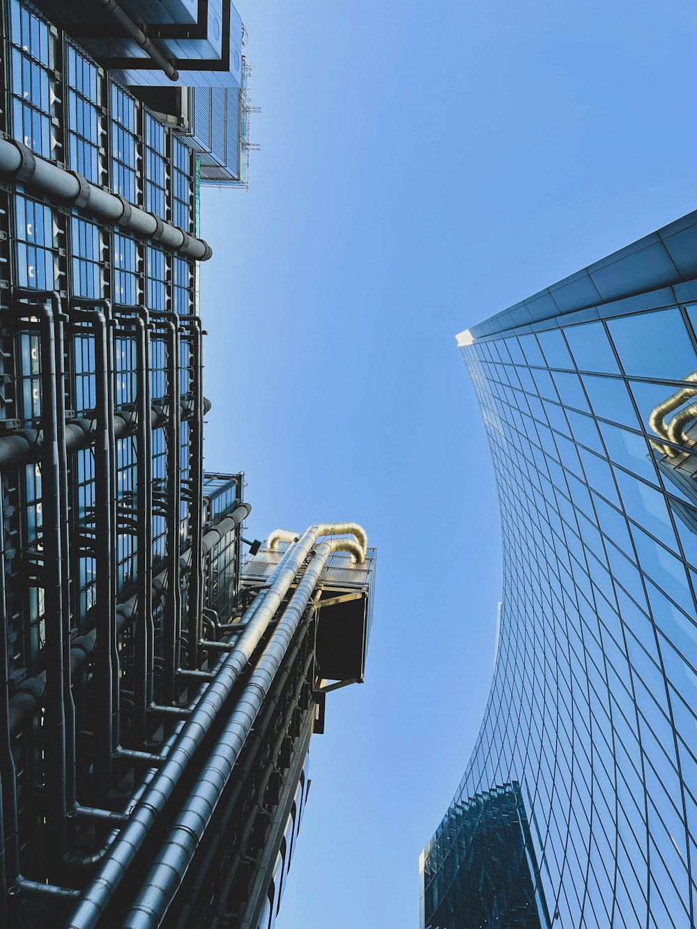 a tall building with a sky scraper in front of it