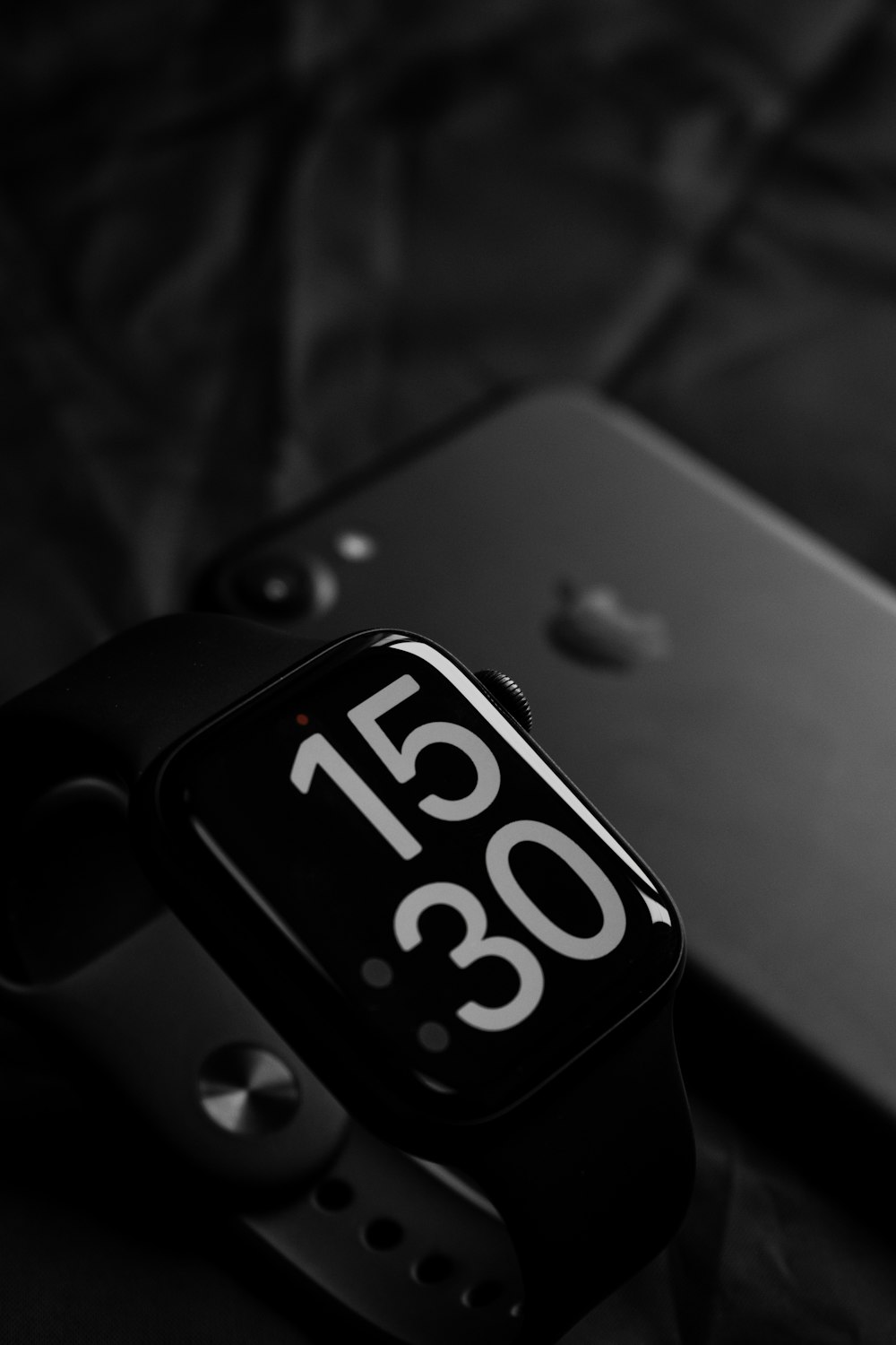 a black and white photo of an apple watch