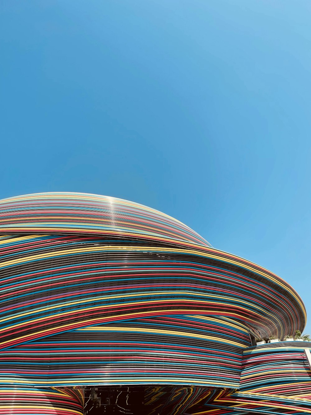 a colorful structure with a blue sky in the background