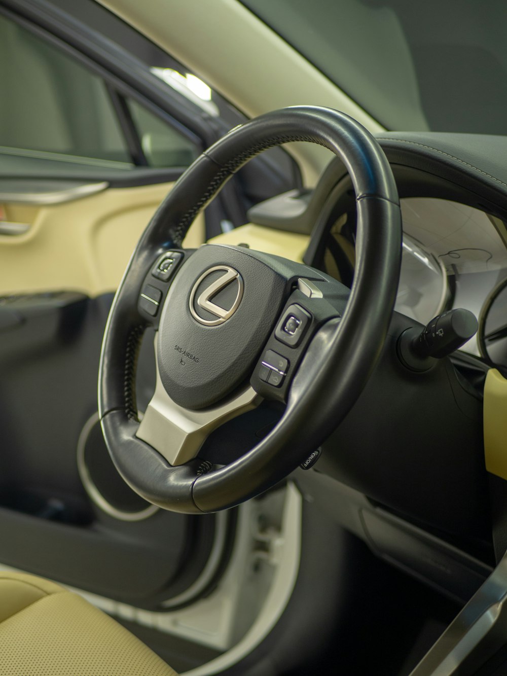 a close up of a steering wheel and dashboard of a car