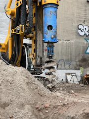 a construction site with a large machine in the middle of it