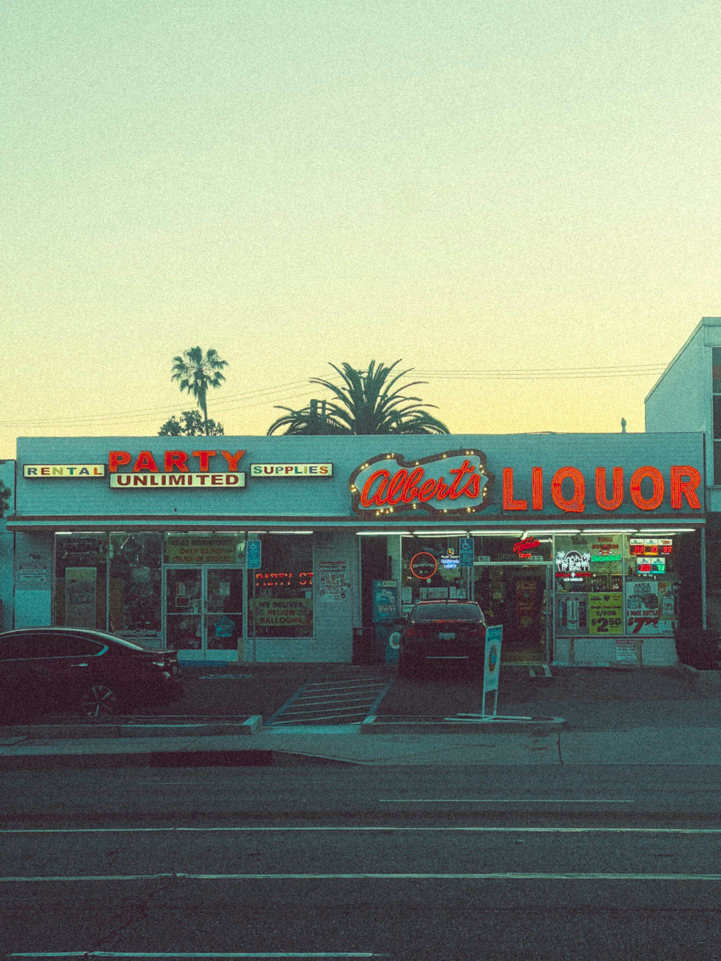 a liquor store sitting on the side of a road