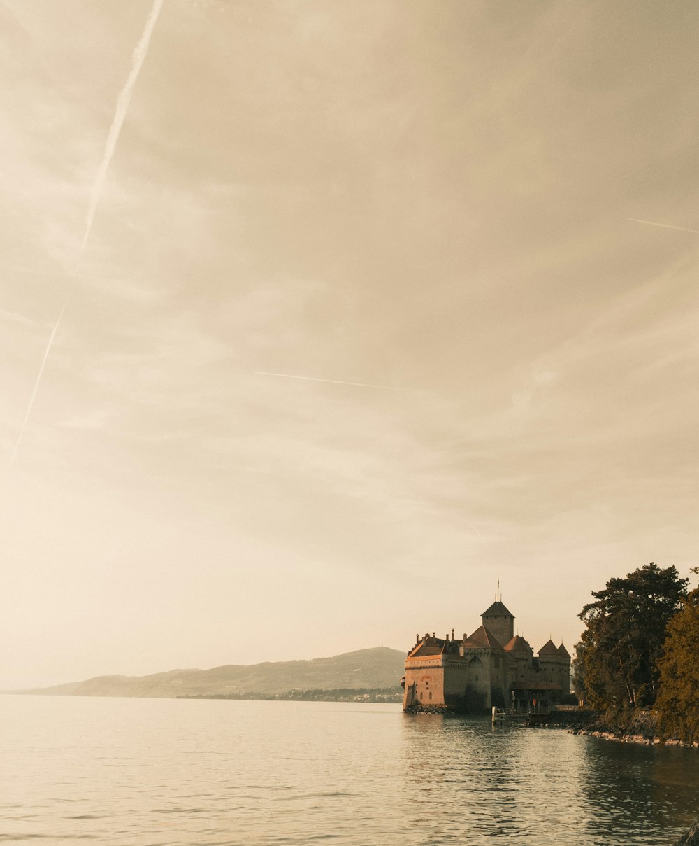 a large body of water with a building on it