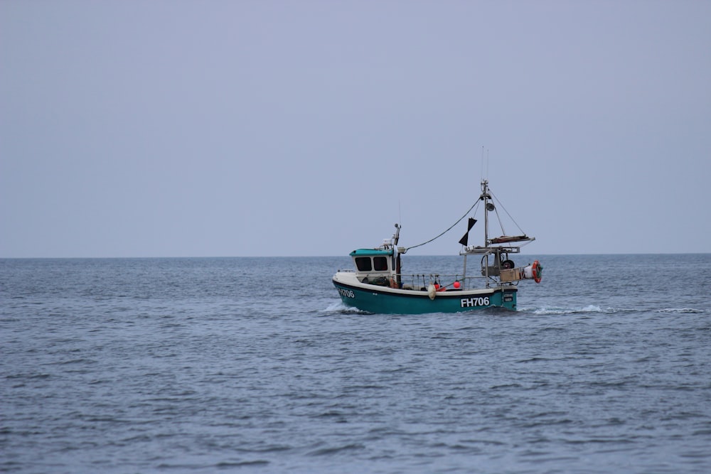 a fishing boat in the middle of the ocean