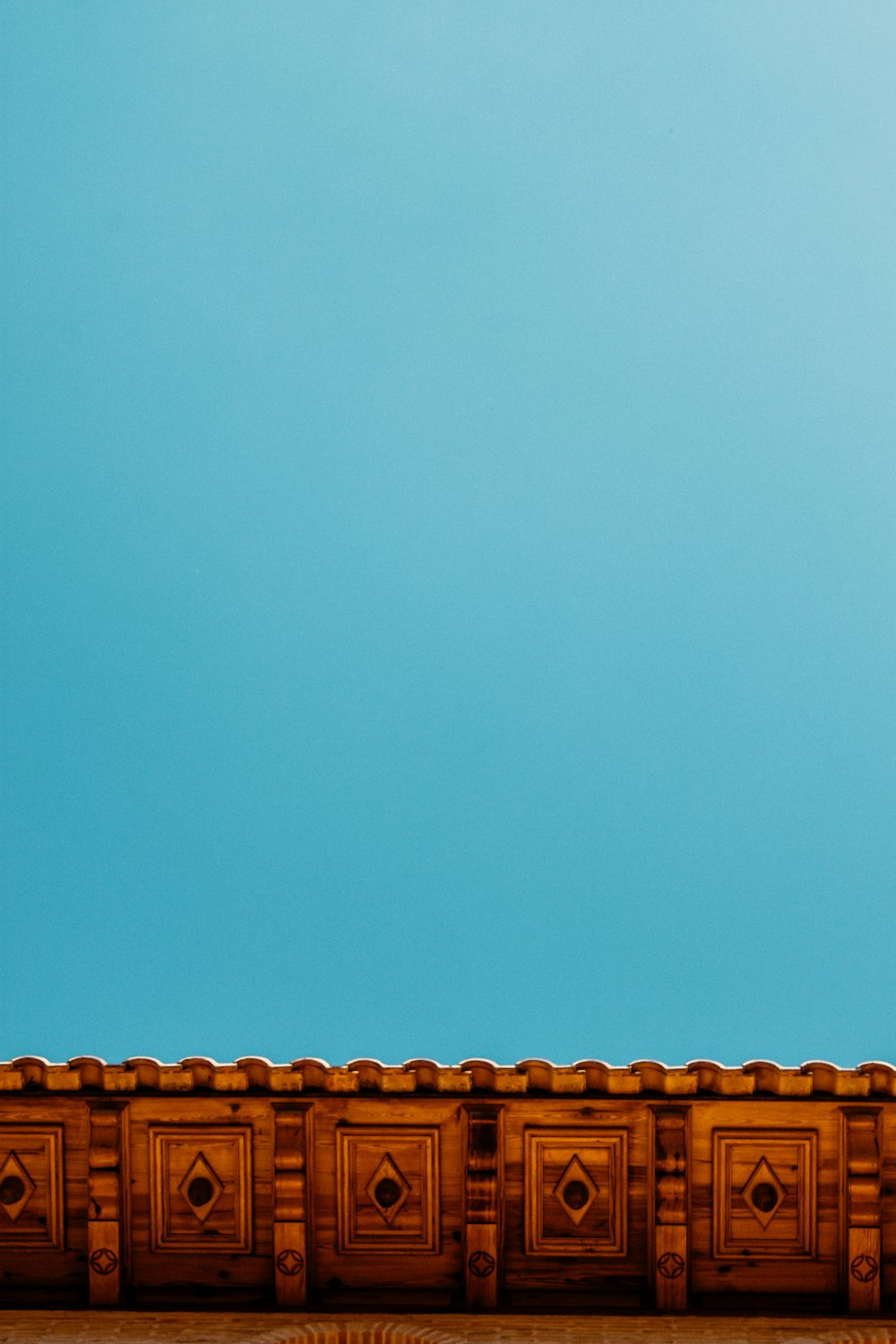 an airplane flying in the sky above a building