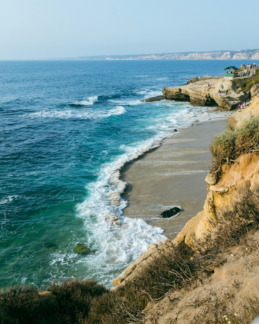 a view of the ocean from the top of a cliff