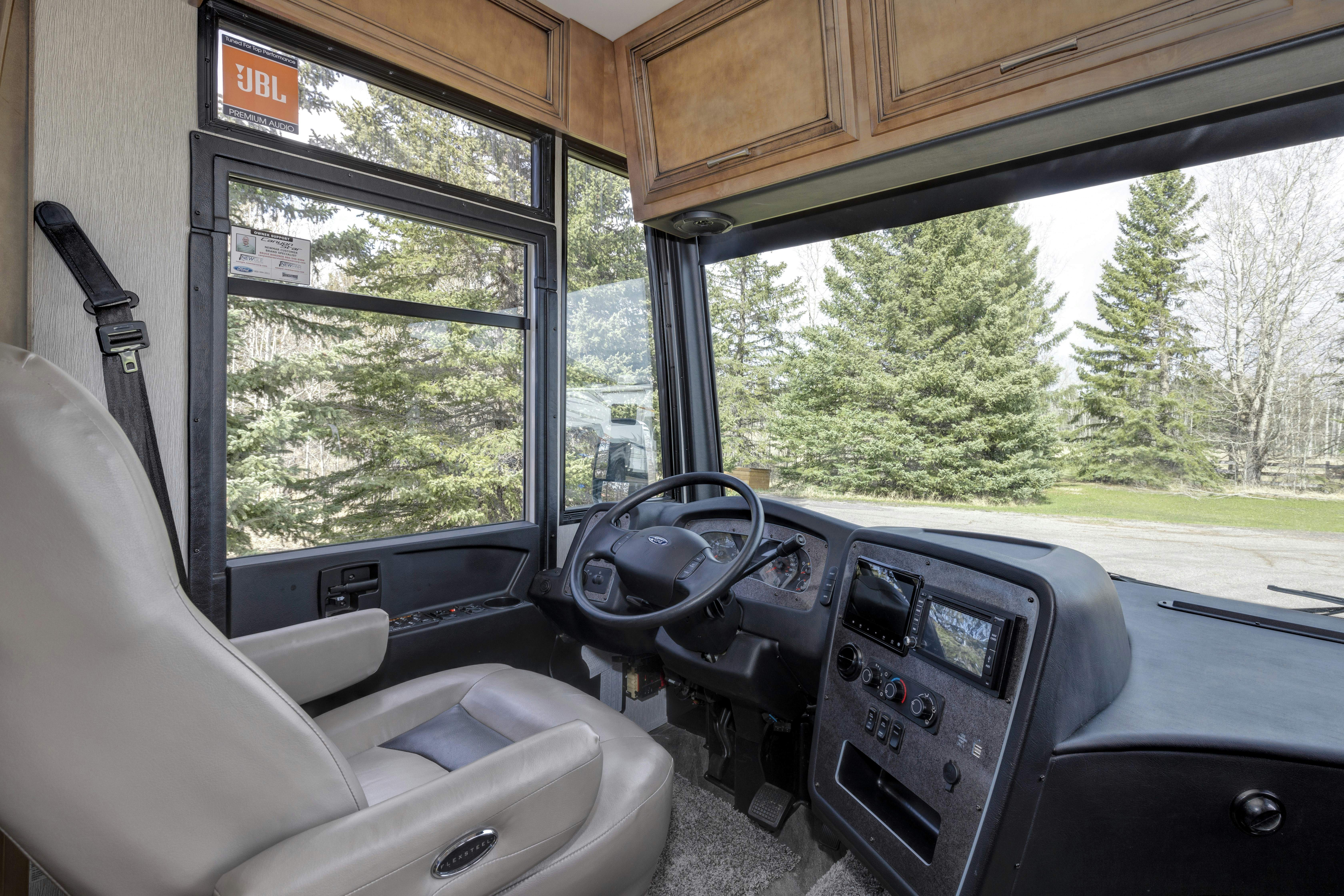 the interior of a bus with a large window