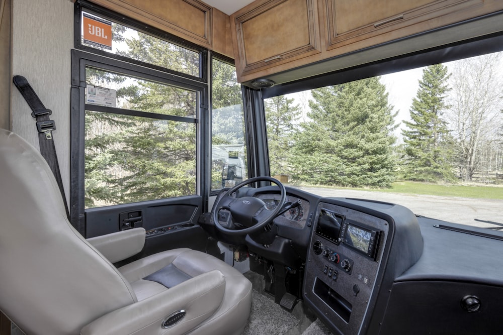 the interior of a bus with a large window