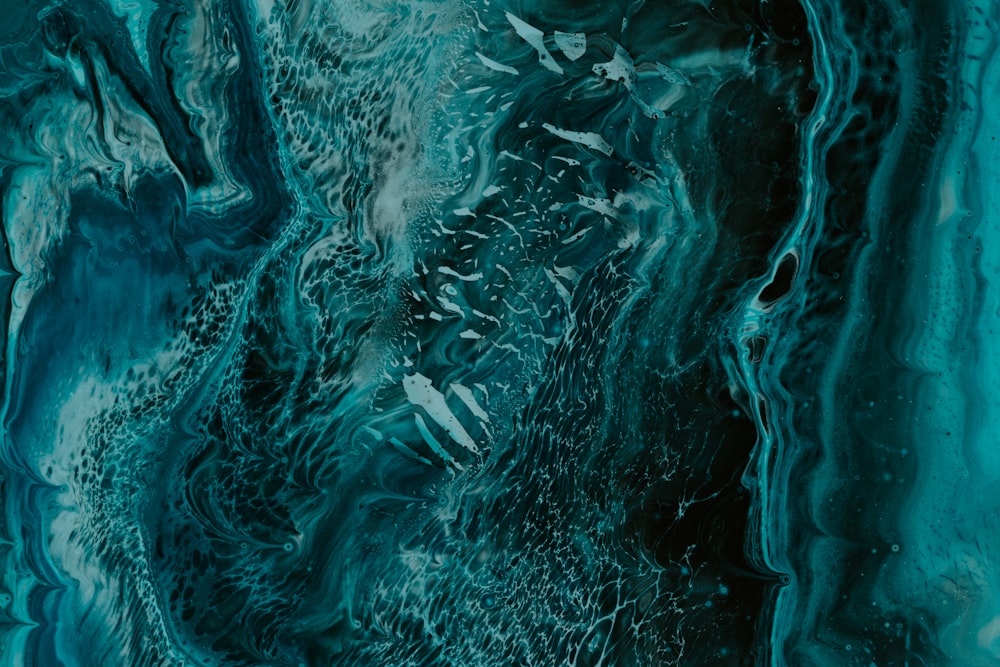 a close up of a blue and black marble