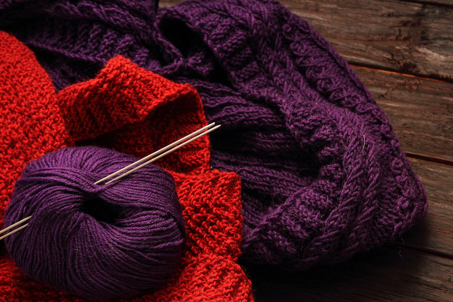 Close-up of a ball of yarn and knitting needles