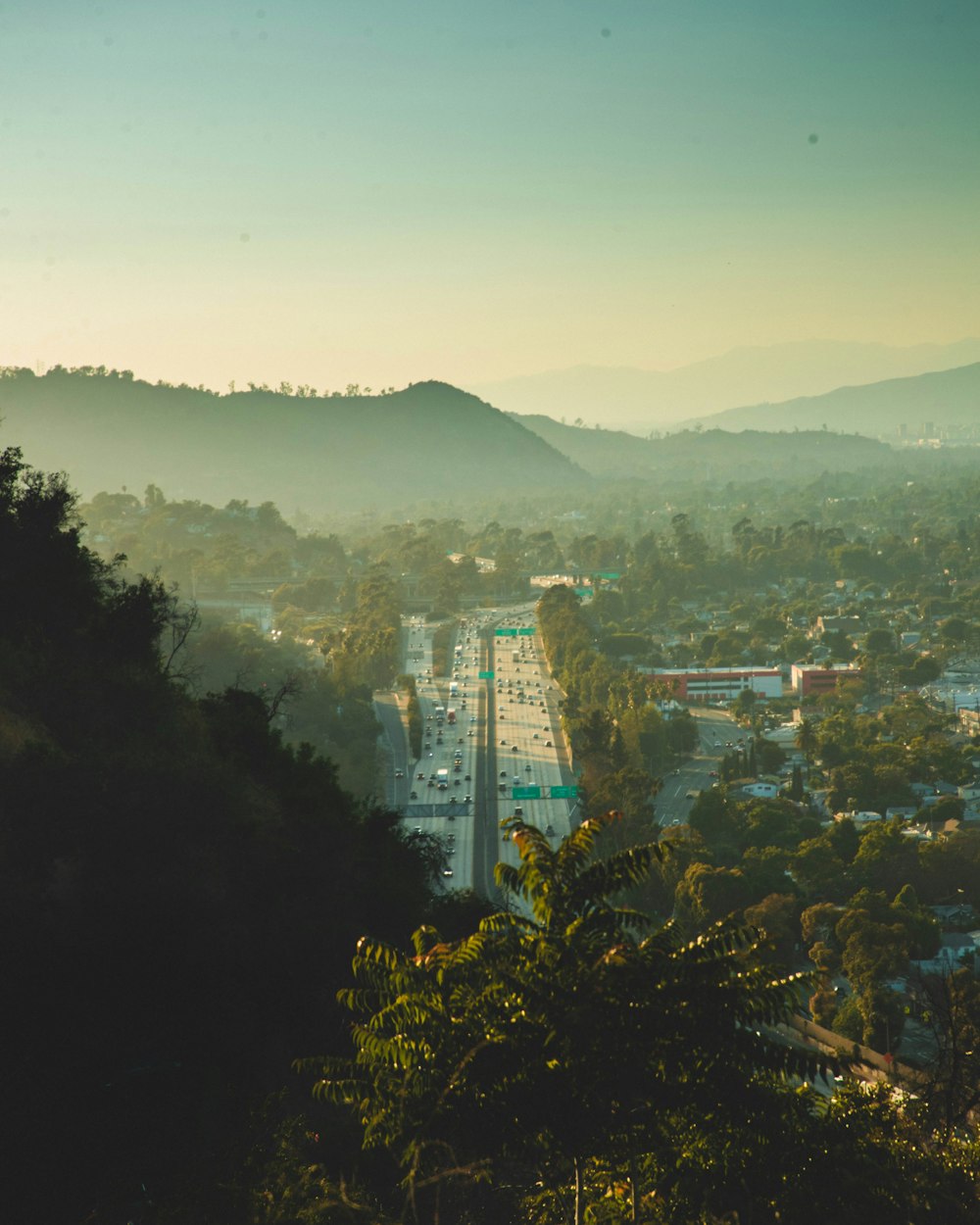 a view of a city with mountains in the background